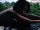 A woman laying in a pool of water with the words "WANIMAL" on it.