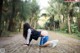 A woman in a blue and white outfit is doing a yoga pose.