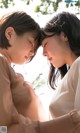 A couple of young women standing next to each other.